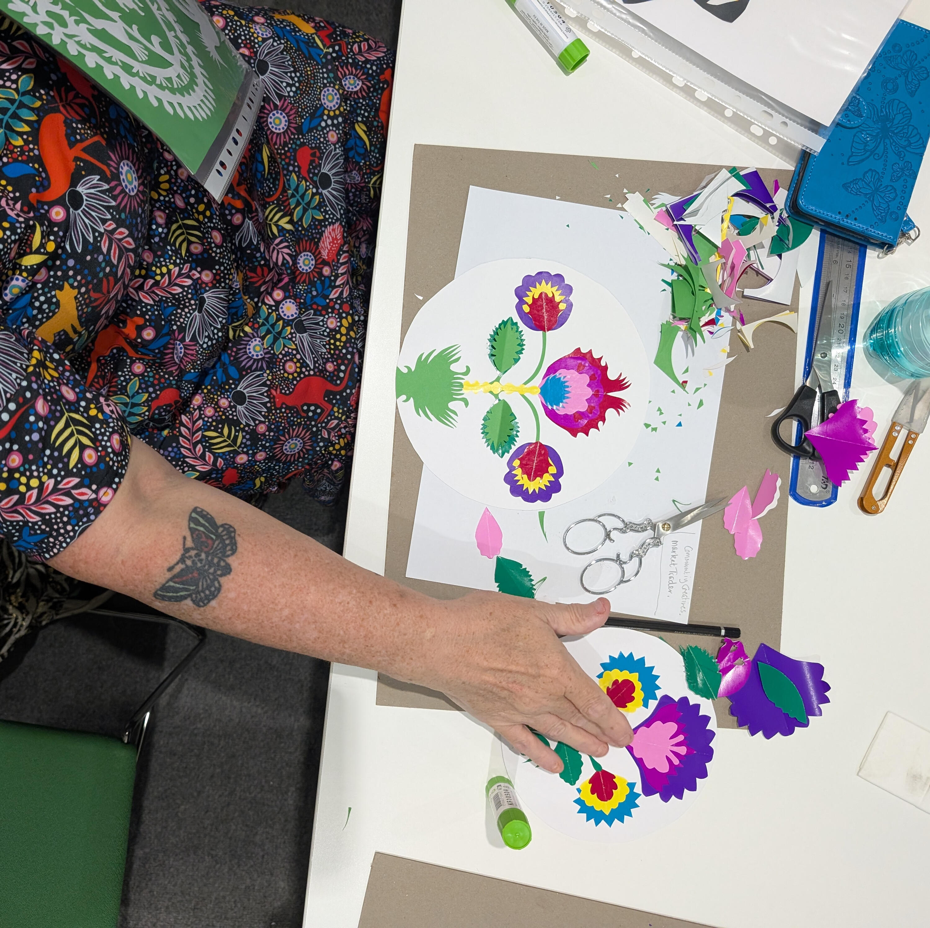Łowicz wycinanki workshop flower paper cut out workshop student with tools Paper cutting workshop in Islington led by School of Ornament